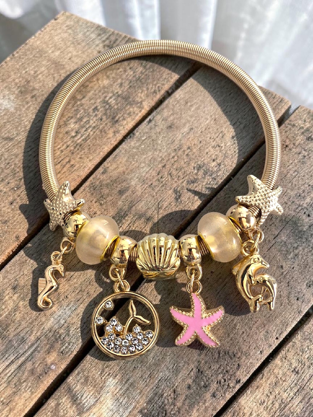 Gold Sea Life Charm Bracelet with Pink Starfish